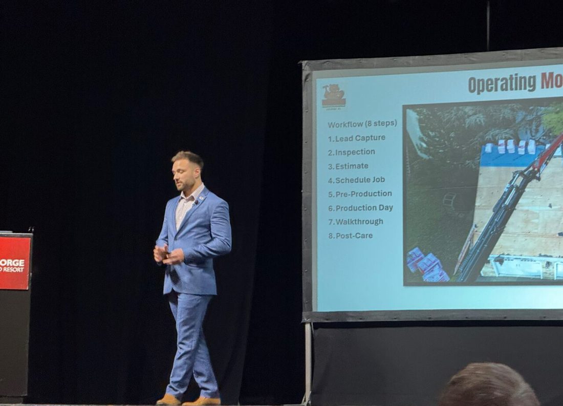 Sam Kensinger presenting a sales operating model on stage